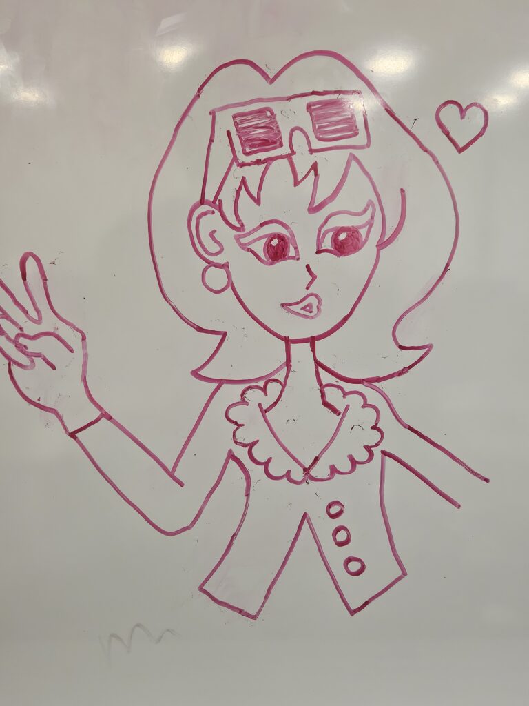 A pink marker drawing on a whiteboard of a girl with short hair and sunglasses on her head, making a peace sign with her hand and a small heart drawn beside her. 